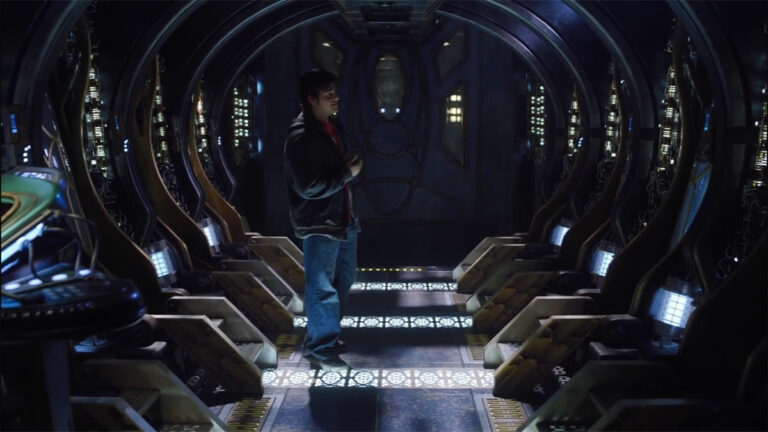 Eli stands among the stasis pods where his friends now sleep ("Gauntlet")